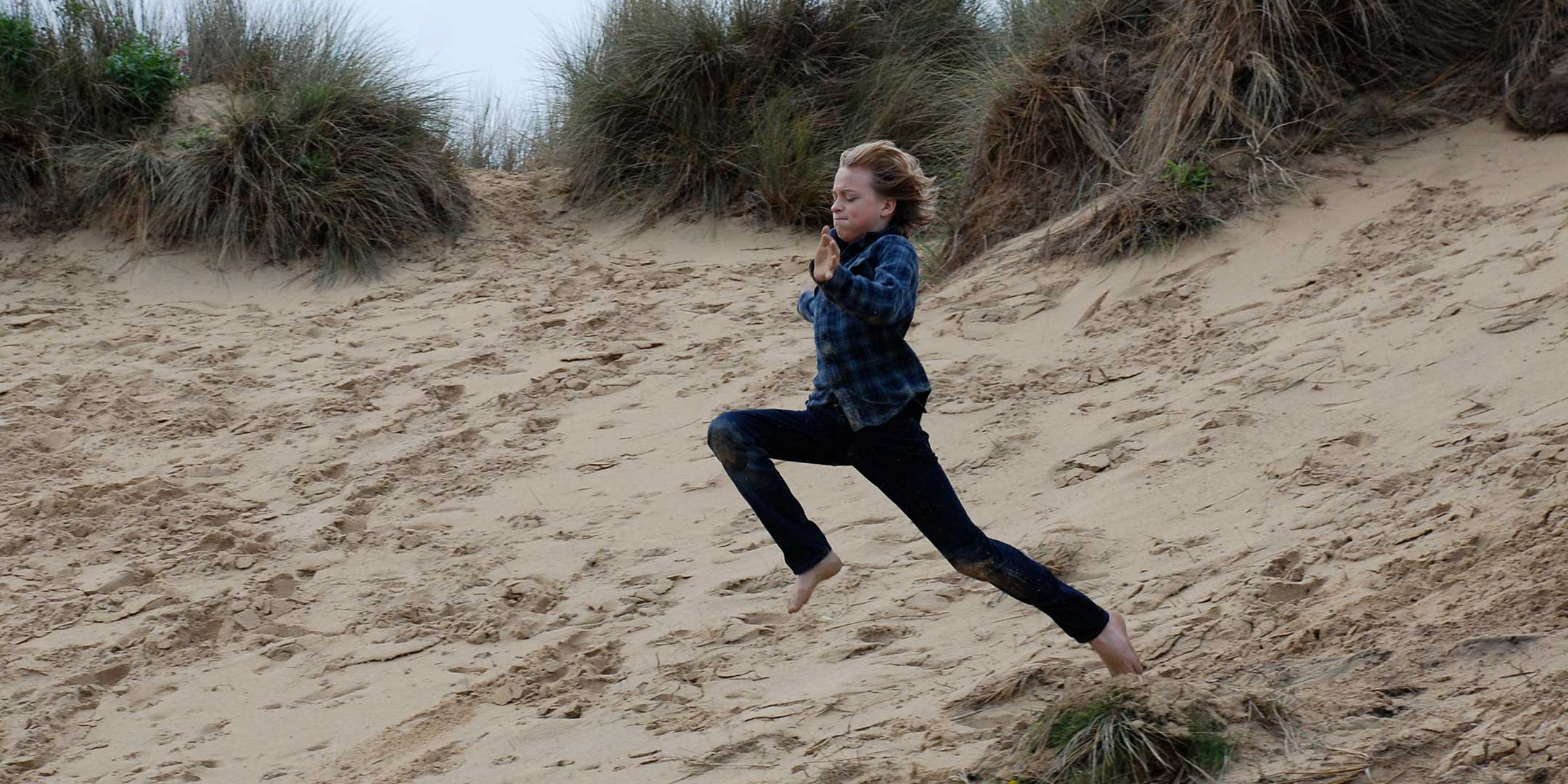 Little Blue House jumping in the dunes